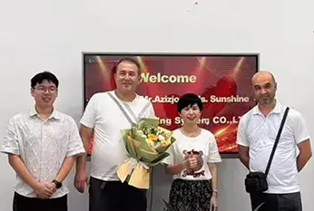 Group photo of customers visiting the company
